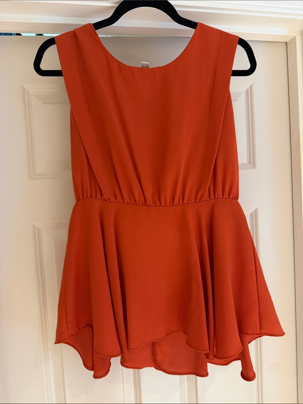 Ya Los Angeles Sleeveless High-Low Peplum Top in burnt orange fall open back
